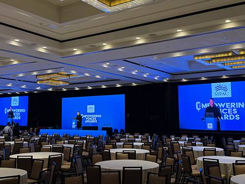 Branded creative content displayed on an LED video wall at a corporate event in Washington, DC