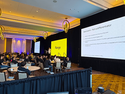 Conference general session and keynote stage with lighting and screens by Prime AV