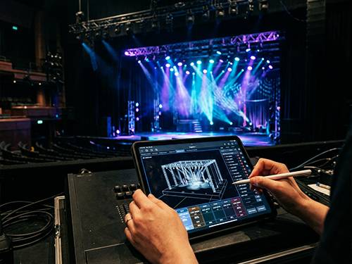 Prime AV designer planning a custom commercial AV and IT system during a consultation