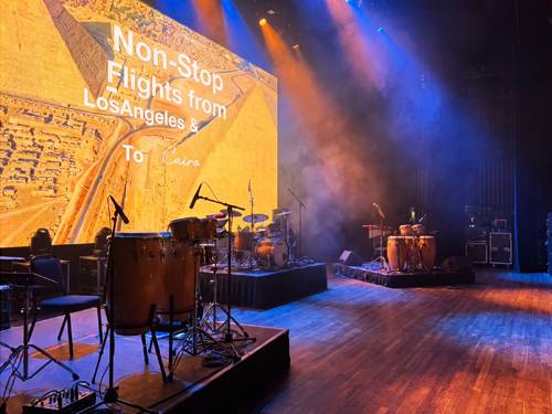Backline instruments and amplifiers staged for a concert by Prime AV