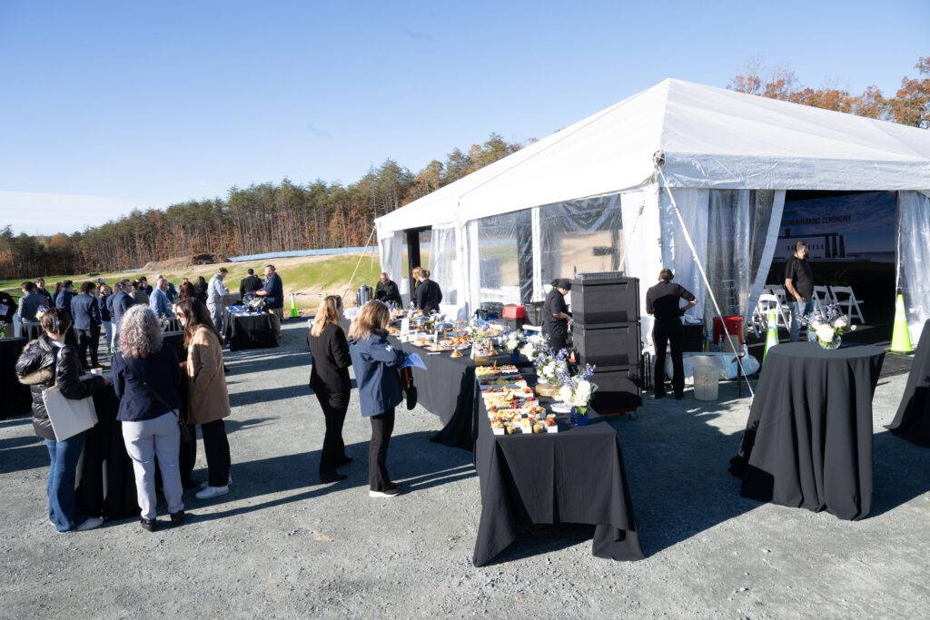 Tents, flooring and seating at a groundbreaking event